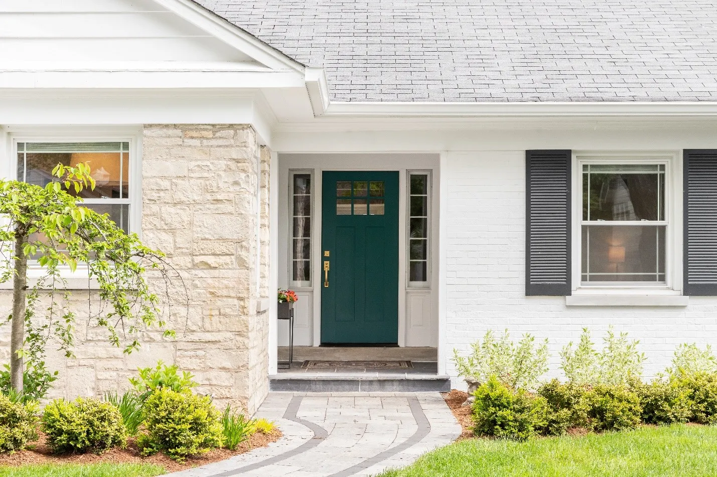  a new, blue front door on a light-colored home exterior  