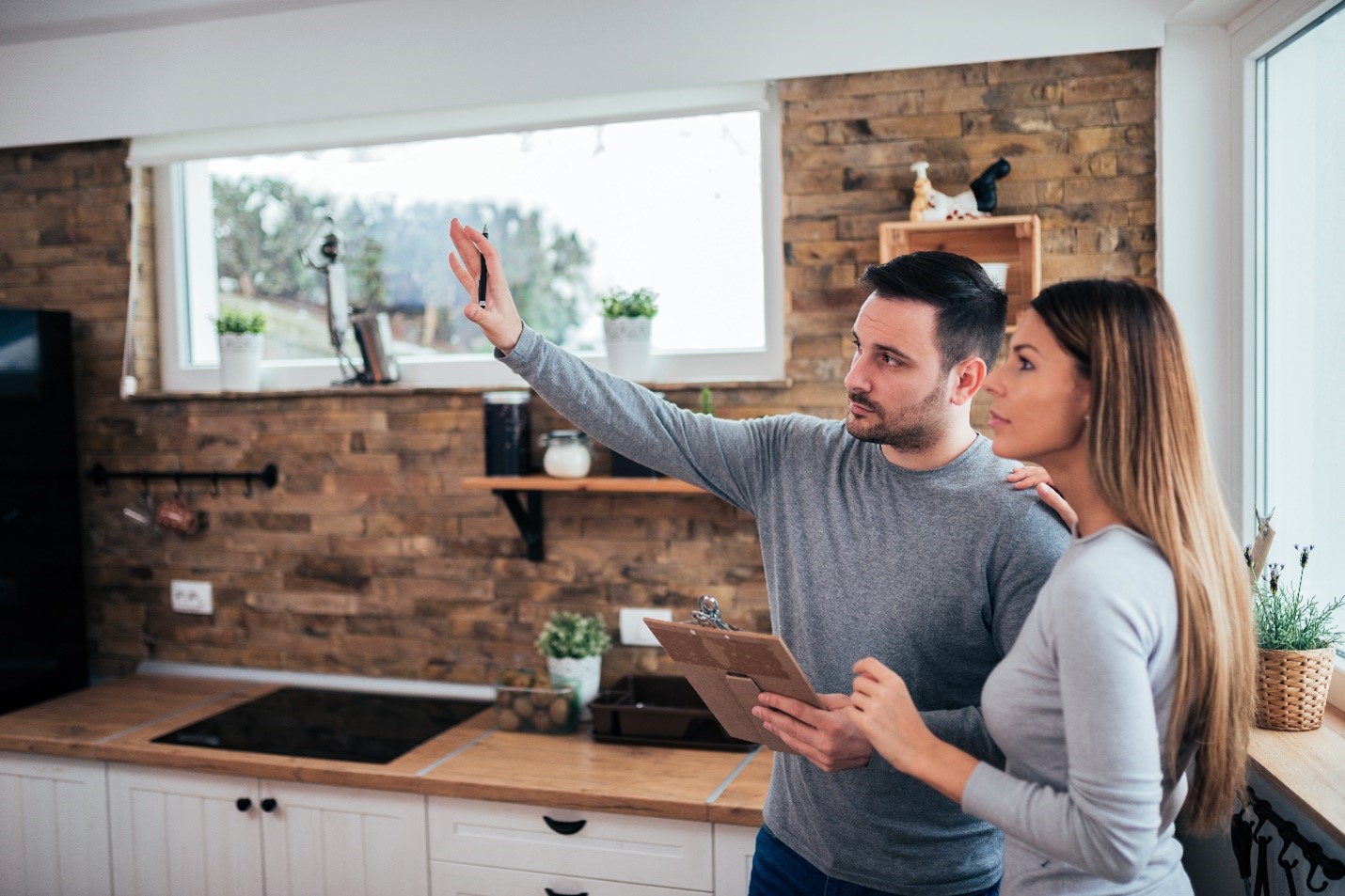 a young couple makes remodeling decisions in their home